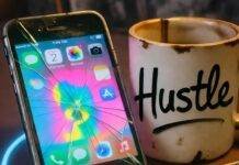 Top Tips for Running Paid Ads with Influencers That Convert Cracked phone with vibrant ad, chipped "Hustle" mug, crumpled $100 bill on messy desk.