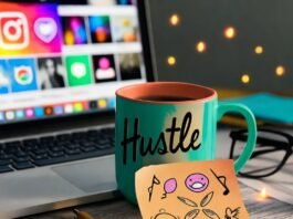 What to Look for in a Micro Influencer Agency? Messy desk with laptop, chipped "Hustle" mug, doodled note, glowing fireflies.