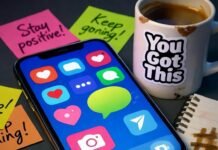 How to Build a Killer Social Media Strategy From Scratch Messy desk with glowing phone, chipped mug, notebook, and neon post-its.